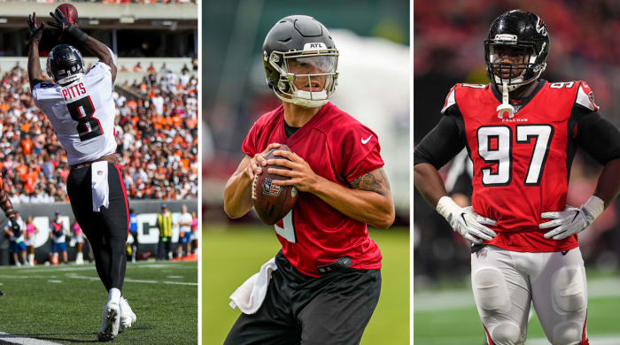 Kyle Pitts stands tall to catch the ball; Desmond Ridder holds the ball getting ready to throw; Grady Jarrett stands with his hands on his hips